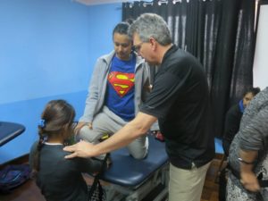 Jack demonstrating a technique to improve ankle dorsiflexion